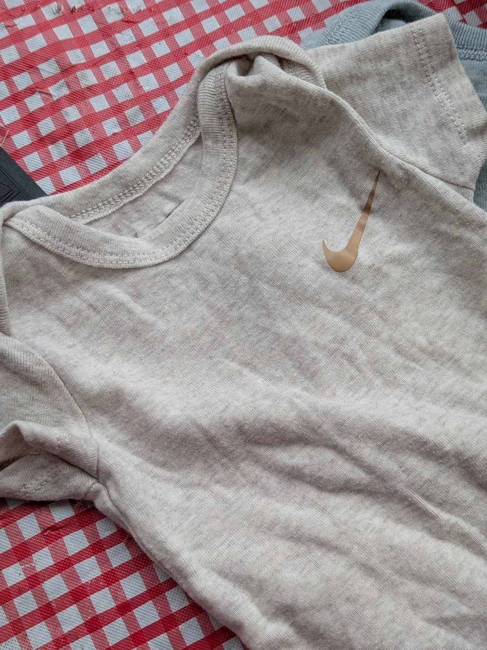 Nike Short-Sleeve Baby Onesies in Cream and Light Blue
